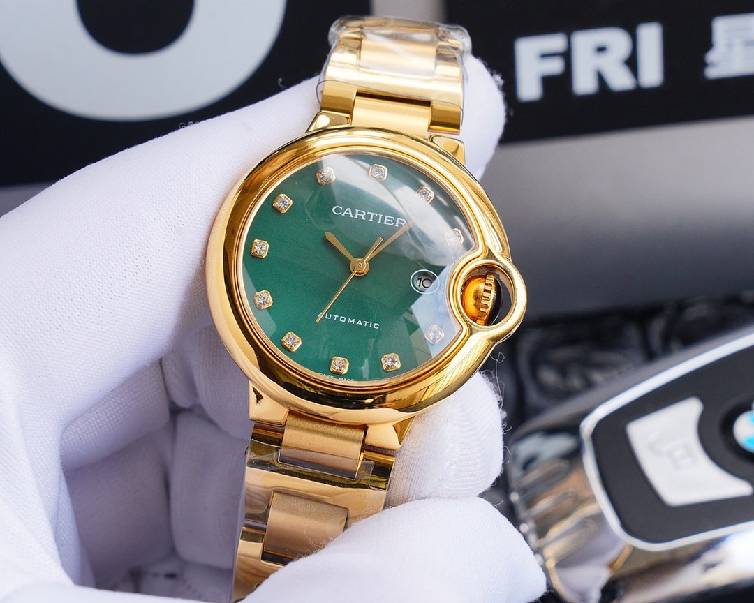 BALLON BLEU 33MM GOLD GREEN DIAL DIAMOND NUMERALS