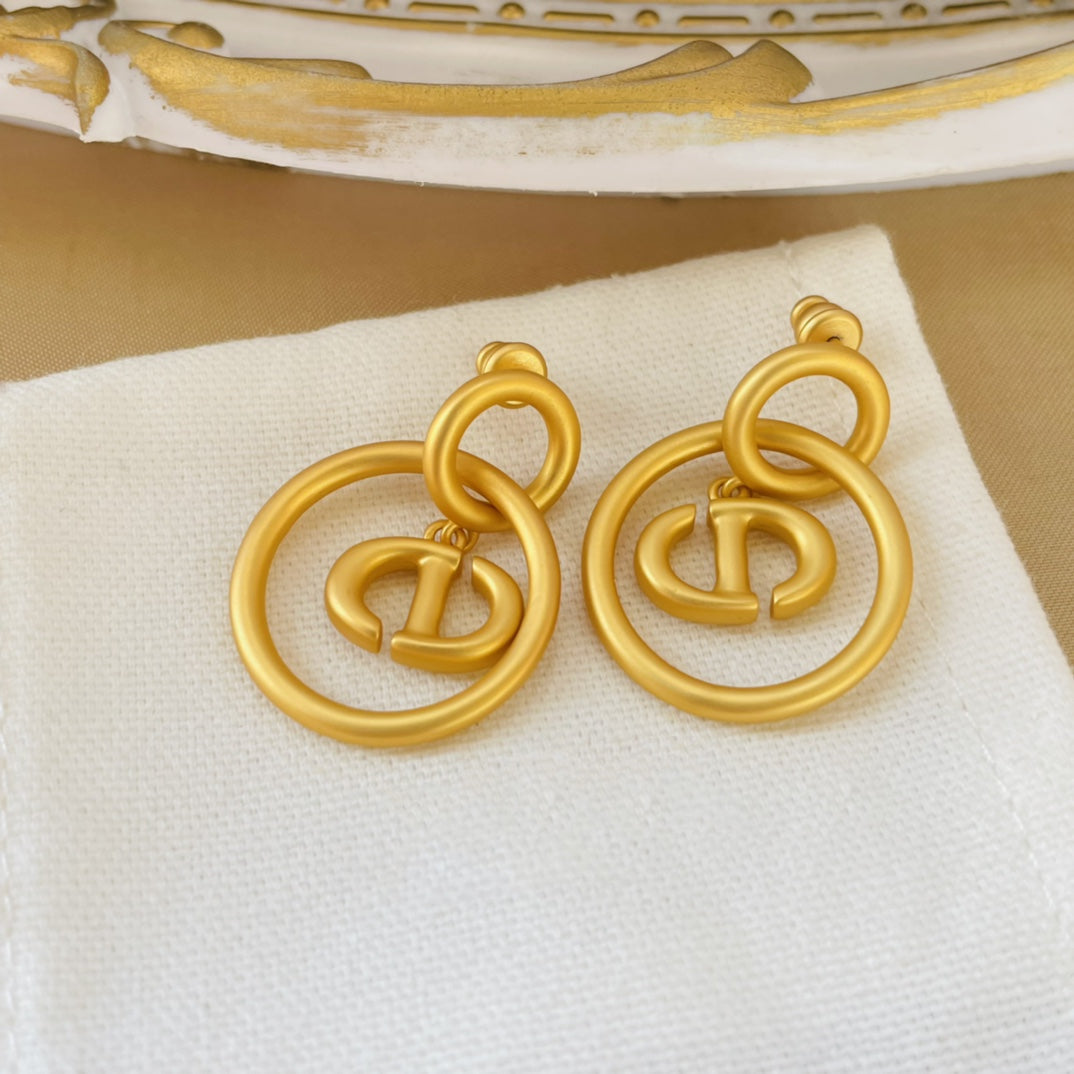 CD NAVY EARRINGS GOLD