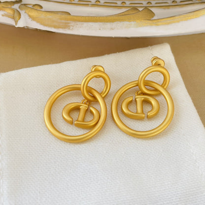 CD NAVY EARRINGS GOLD