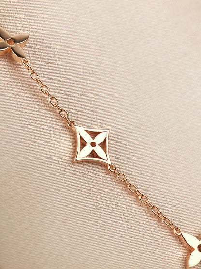 STAR AND SUN 7 MOTIFS GOLD BRACELET