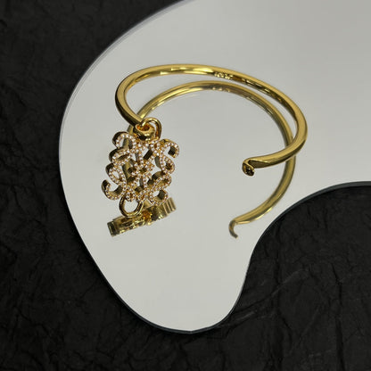 PAVED ANAGRAM OPEN GOLD BRACELET