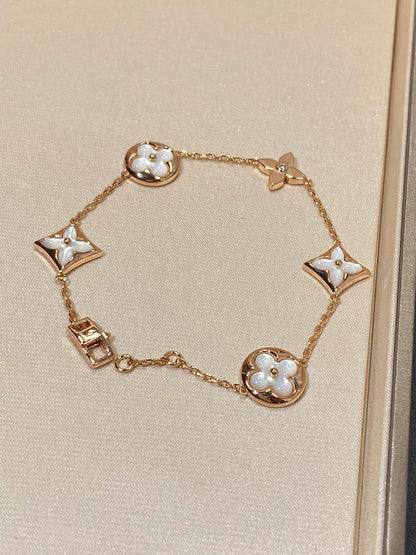 STAR AND SUN 5 MOTIF MOP PINK GOLD BRACELET