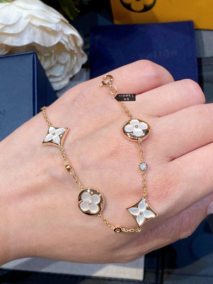 STAR AND SUN 4 MOTIF WHITE MOP PINK GOLD BRACELET