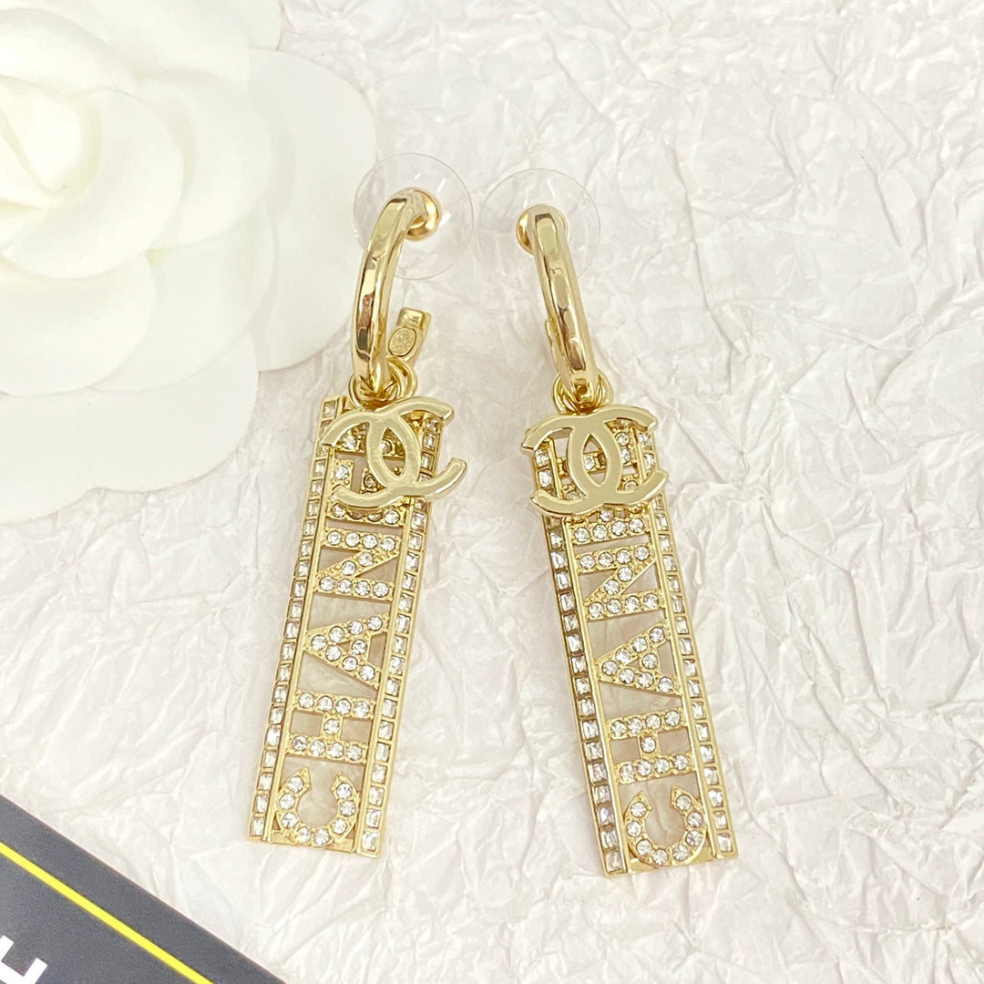 CC TEXT DIAMOND PAVED LIGHT GOLD DROP EARRINGS