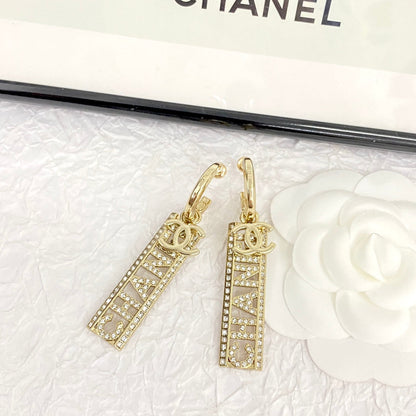 CC TEXT DIAMOND PAVED LIGHT GOLD DROP EARRINGS