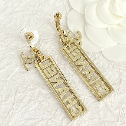 CC TEXT DIAMOND PAVED LIGHT GOLD DROP EARRINGS