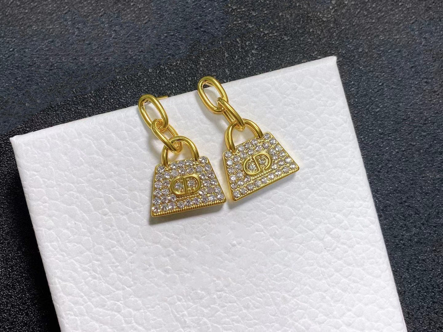 CD BAG GOLD DIAMOND EARRINGS