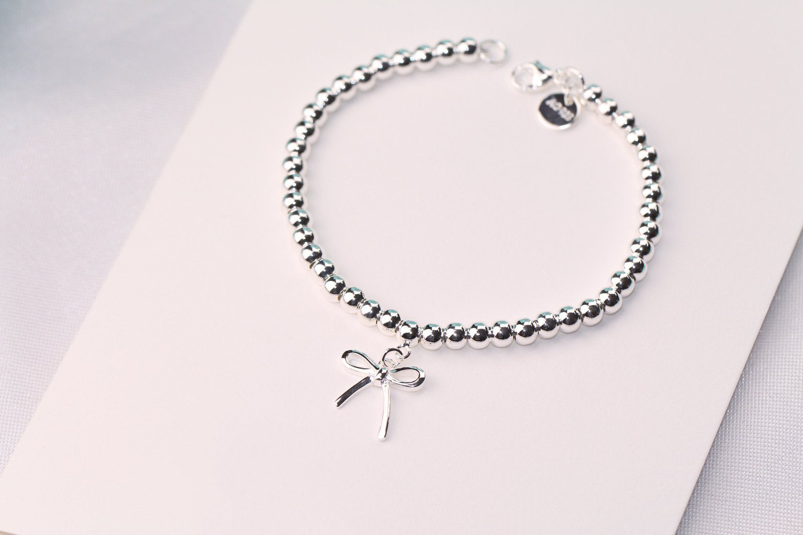 STERLING SILVER BOW BEAD BRACELET