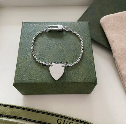 GG LOGO HEART-SHAPED PENDANT SILVER BRACELET