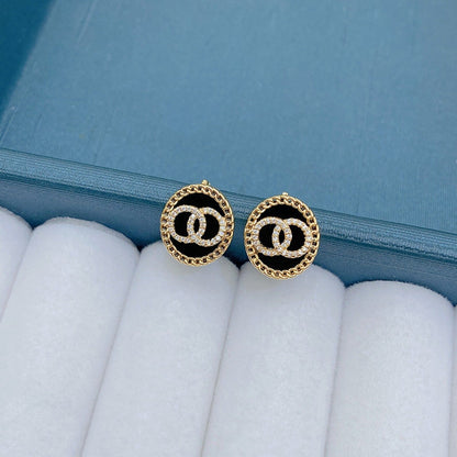 DOUBLE CIRCLE DIAMOND ONYX STUD EARRINGS